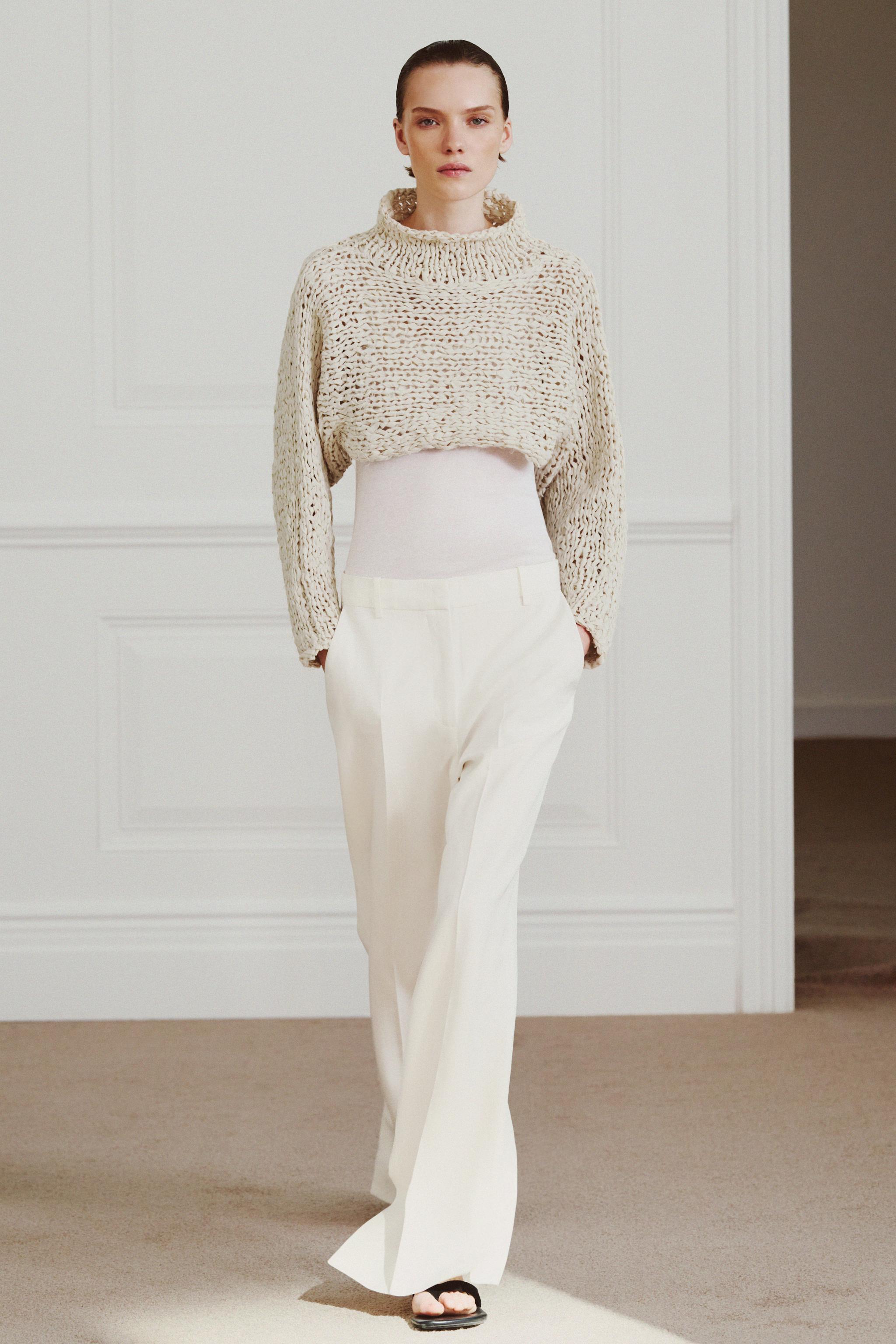 PULL COURT EN MAILLE À BANDE ENTRELAÇÉE
